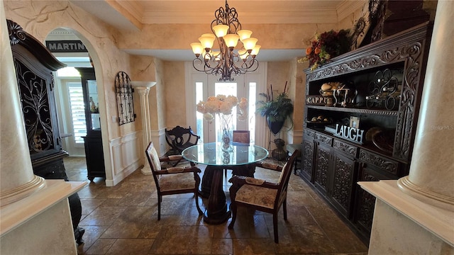 tiled dining area featuring decorative columns, a chandelier, and a wealth of natural light