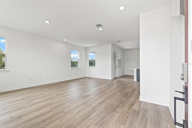 unfurnished living room featuring light hardwood / wood-style flooring