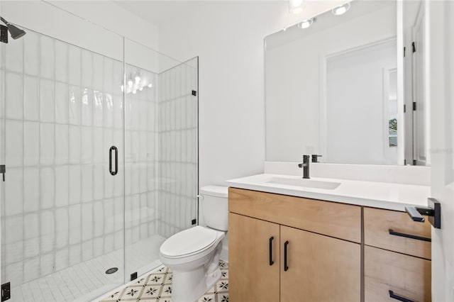 bathroom featuring vanity, toilet, and walk in shower