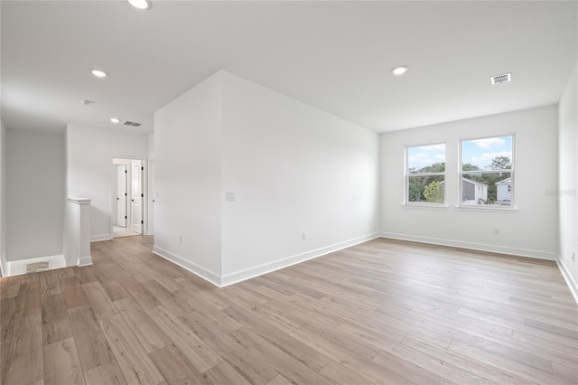 unfurnished room with light hardwood / wood-style flooring