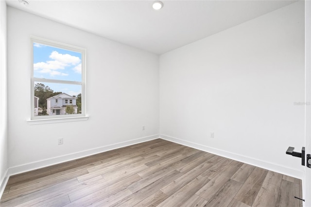 unfurnished room with light hardwood / wood-style floors