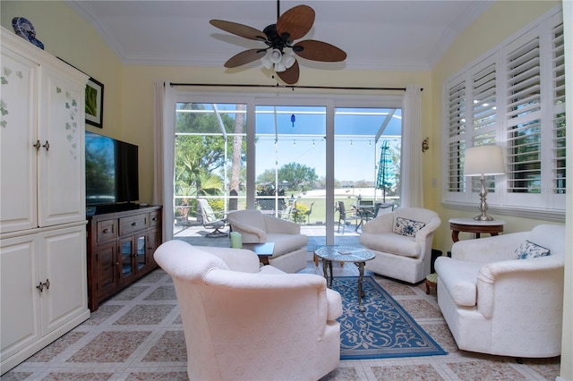 living room with crown molding, light tile flooring, and ceiling fan