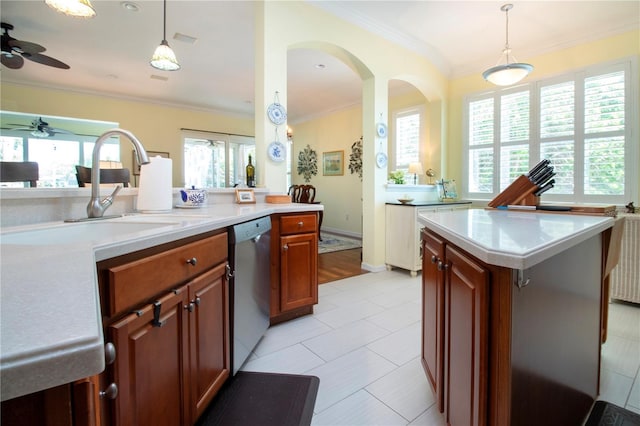 kitchen featuring plenty of natural light, decorative light fixtures, ceiling fan, and light tile flooring