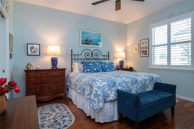 bedroom with ceiling fan and dark hardwood / wood-style floors