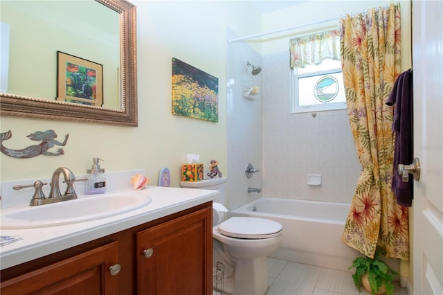 full bathroom with tile floors, toilet, vanity, and shower / tub combo with curtain