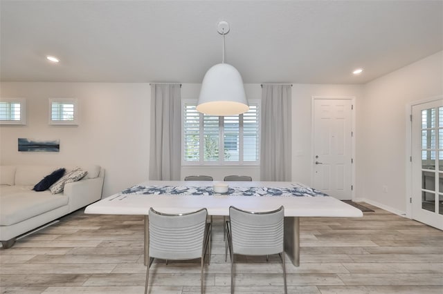 dining space with light hardwood / wood-style flooring