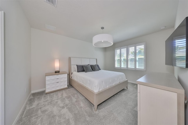 bedroom with light carpet