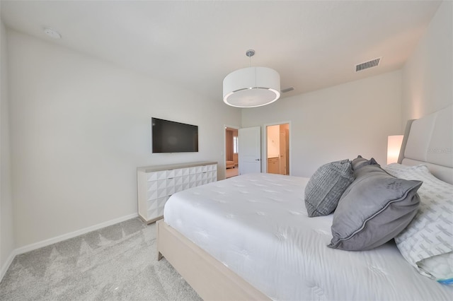 bedroom with light colored carpet