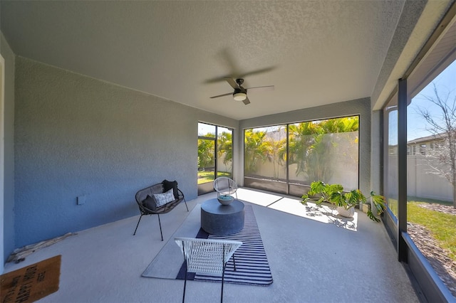 sunroom / solarium with ceiling fan