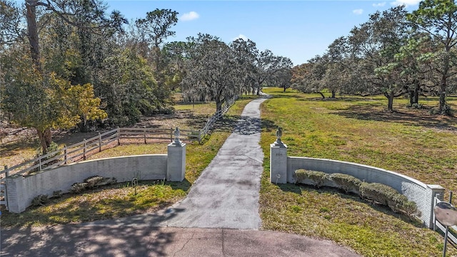 view of home's community with a yard