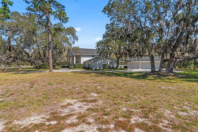 view of yard featuring a garage