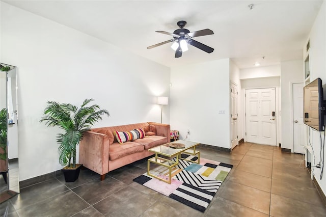 tiled living room with ceiling fan