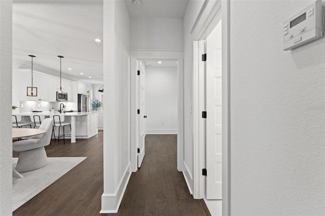 hall with dark hardwood / wood-style floors