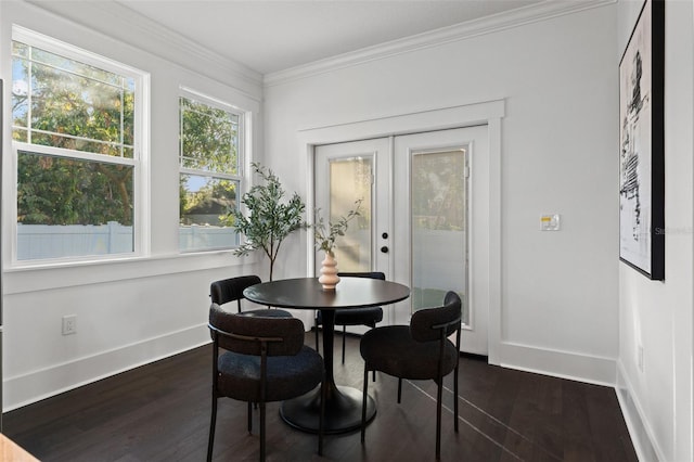 dining room with crown molding, french doors, and dark wood-type flooring