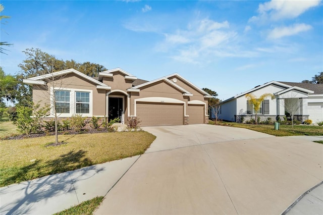 view of front facade with a front yard and a garage