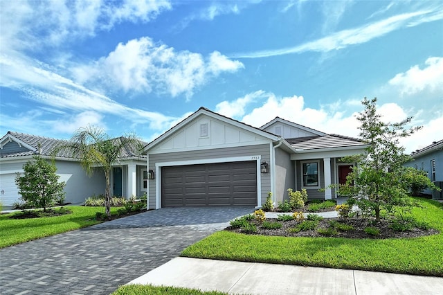 view of front of property with a front lawn and a garage