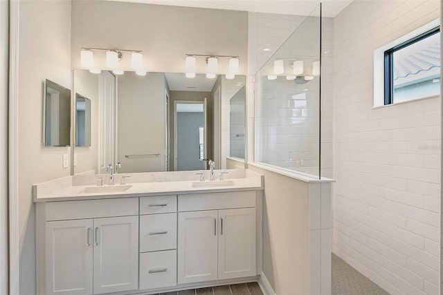 bathroom featuring vanity and a tile shower