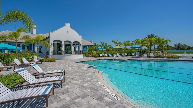 view of swimming pool with a patio area