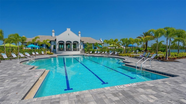 view of swimming pool featuring a patio area