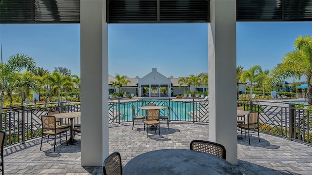 view of patio / terrace featuring a community pool