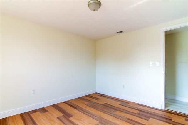 empty room featuring wood-type flooring