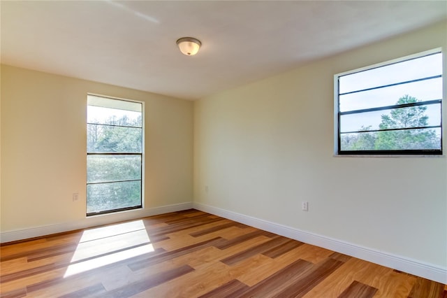 unfurnished room with light hardwood / wood-style flooring