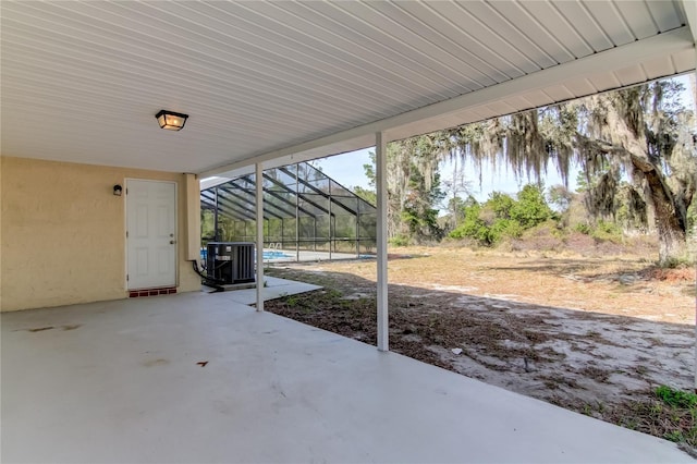 view of patio / terrace with glass enclosure and central AC