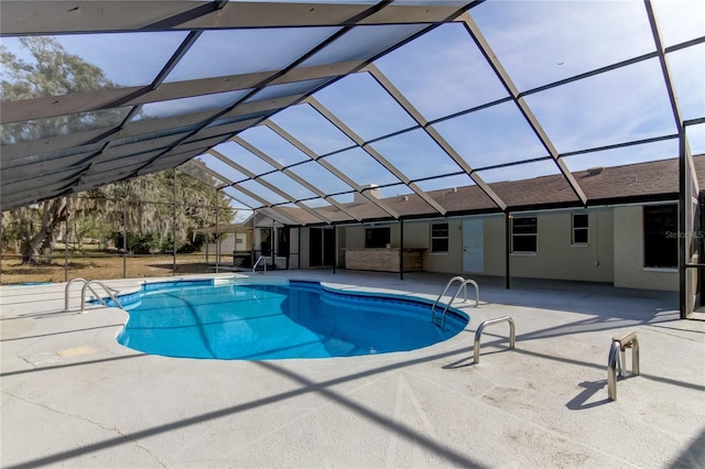 view of pool featuring a patio and a lanai