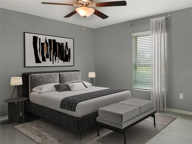 carpeted bedroom featuring ceiling fan