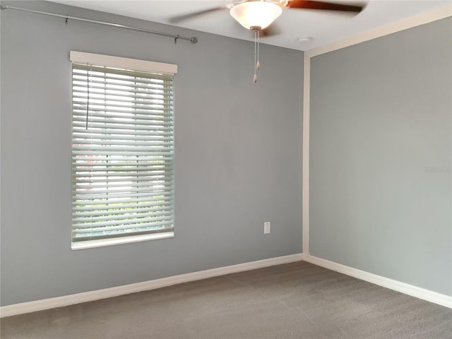 carpeted empty room with ceiling fan