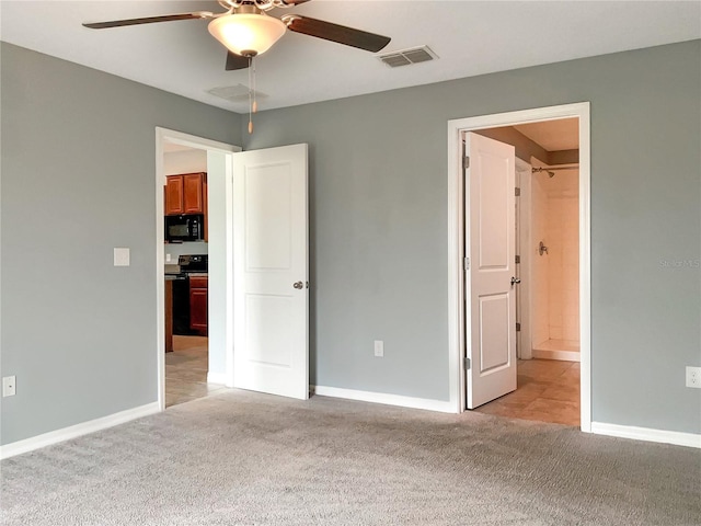 unfurnished bedroom with light carpet, ensuite bath, and ceiling fan