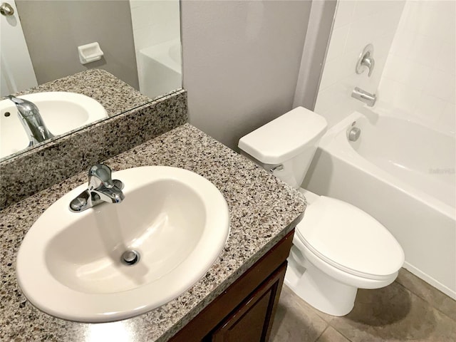 full bathroom featuring vanity, bathing tub / shower combination, and toilet