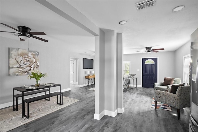 interior space featuring ceiling fan and dark wood-type flooring