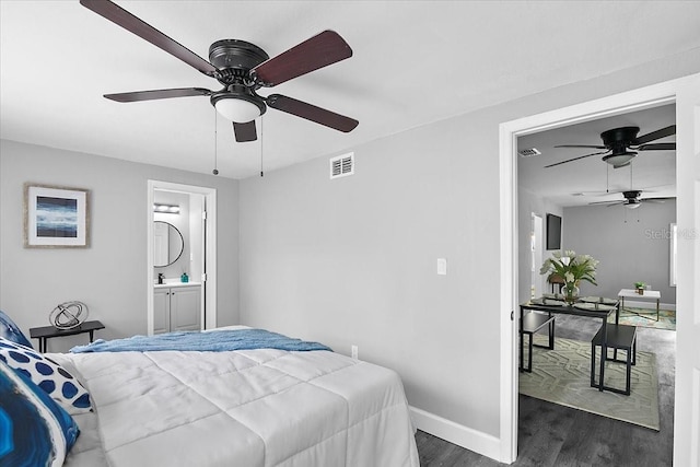 bedroom with ensuite bathroom, ceiling fan, and dark hardwood / wood-style flooring