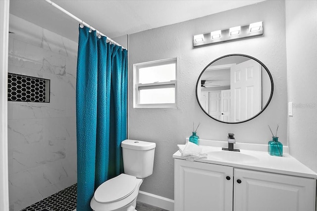 bathroom featuring toilet and vanity with extensive cabinet space