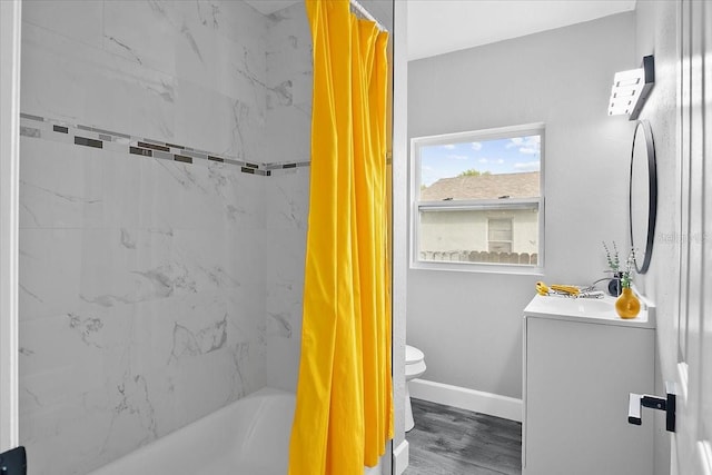 full bathroom with vanity, wood-type flooring, shower / bath combo with shower curtain, and toilet