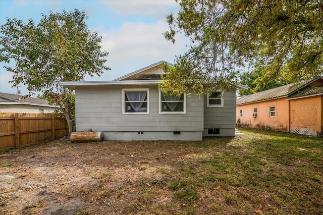 back of house with a yard