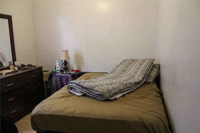 bedroom featuring light tile floors