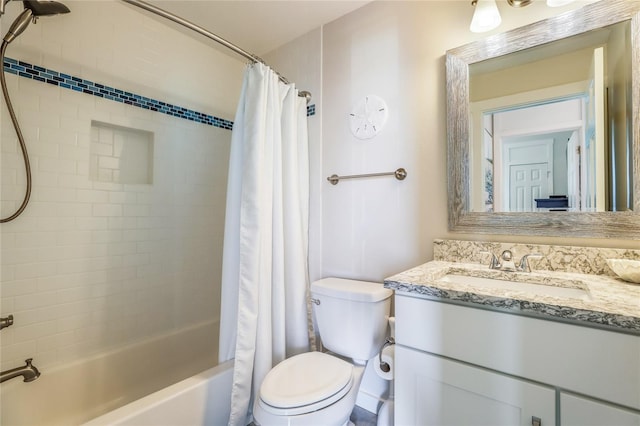 full bathroom featuring vanity, shower / bath combination with curtain, and toilet