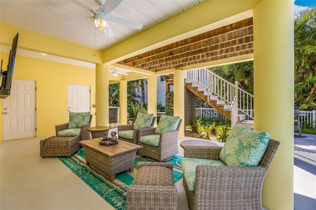 view of patio with outdoor lounge area and ceiling fan