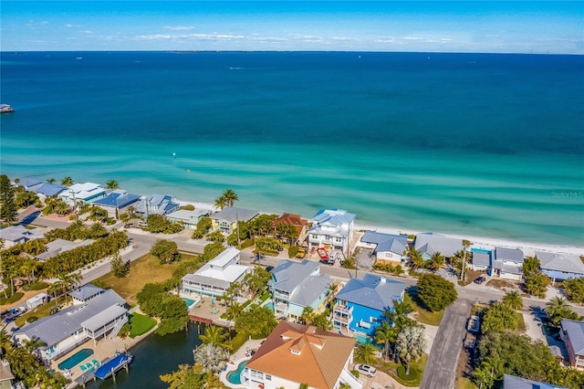 birds eye view of property featuring a view of the beach and a water view