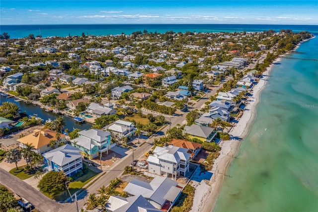 bird's eye view with a beach view and a water view