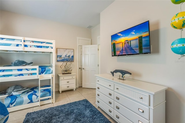 bedroom with light tile patterned floors