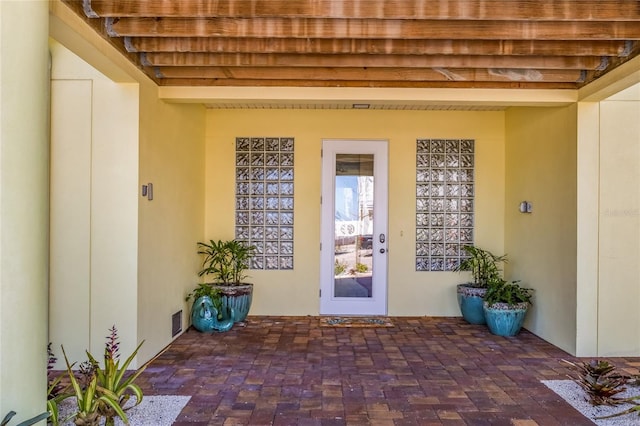 property entrance with a patio area