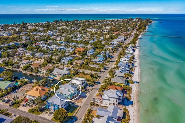 aerial view featuring a water view and a beach view