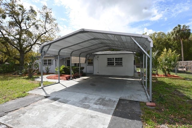 exterior space featuring a front yard and a carport