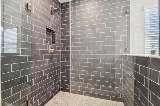 bathroom featuring tiled shower