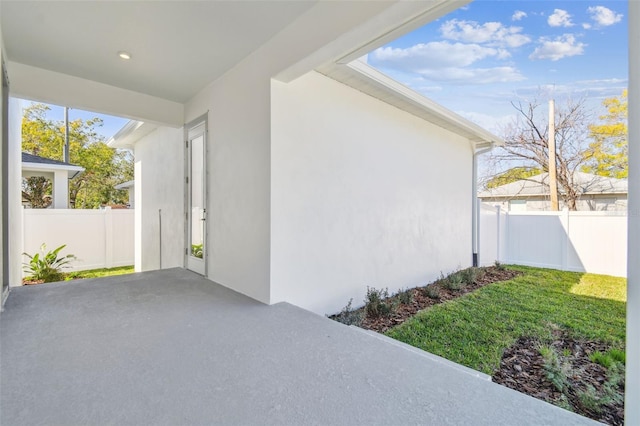 entrance to property with a patio