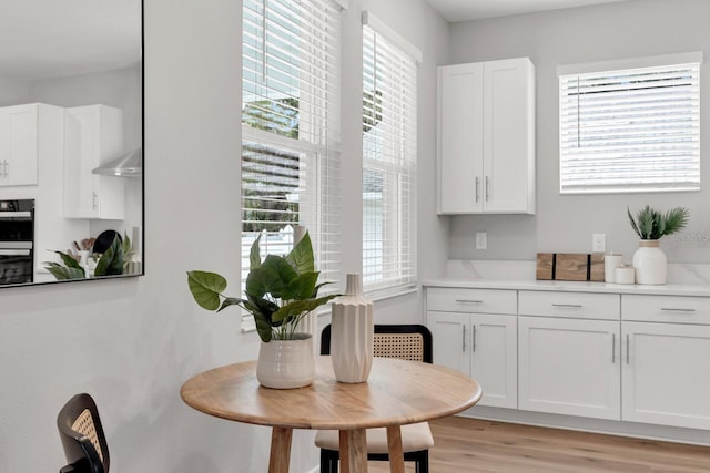 dining space with light wood-type flooring