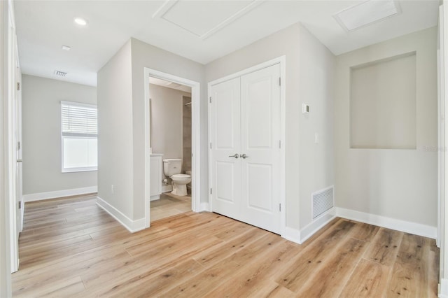 corridor featuring light hardwood / wood-style floors